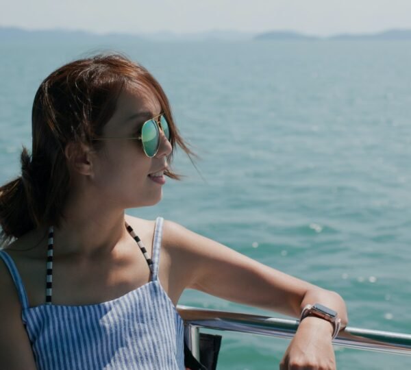 Woman wear sunglass on boat trip