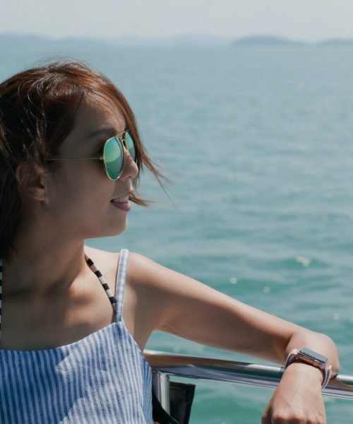 Woman wear sunglass on boat trip